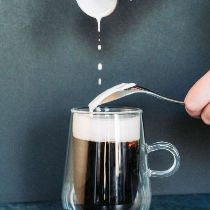 Pouring the Bailey's Cream on the Coffee