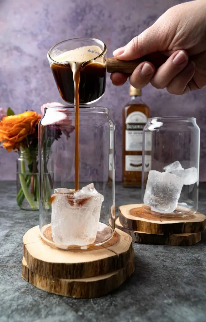 Pouring the espresso mixture on ice for Almande Baileys.