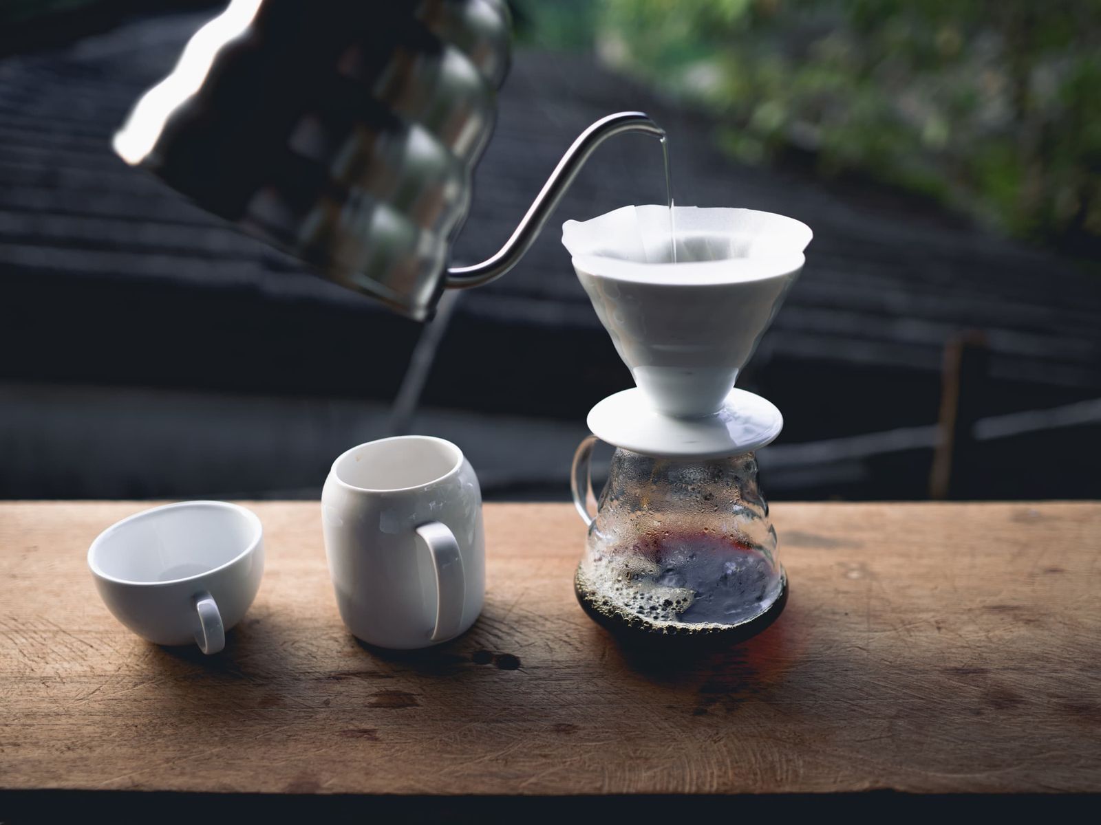 Making drip coffee at the window.