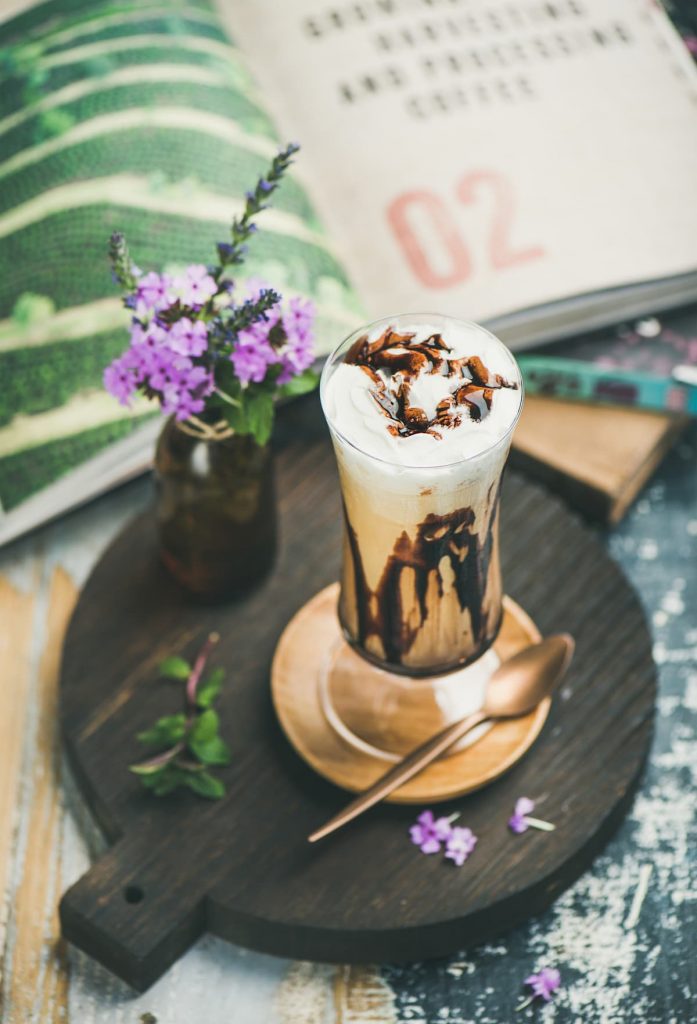 Iced mocha coffee with whipped cream in glass
