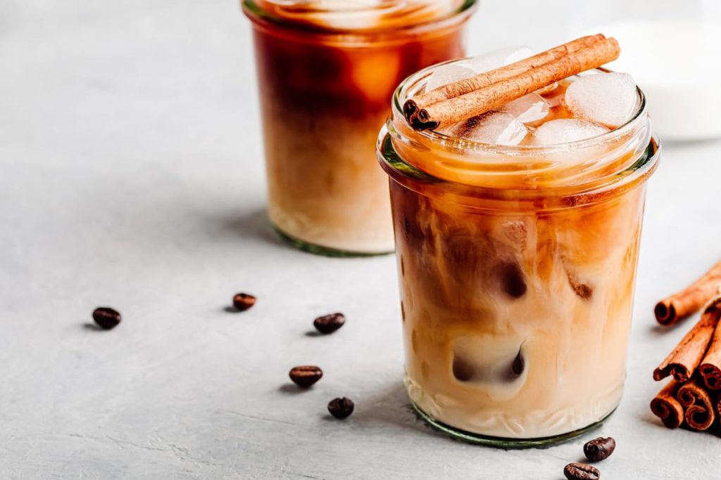 Vanilla Cinnamon Iced Coffee in glass jars