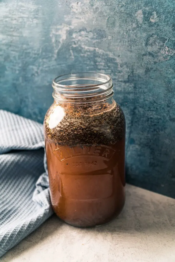 Adding water to mason jar for cold brew coffee