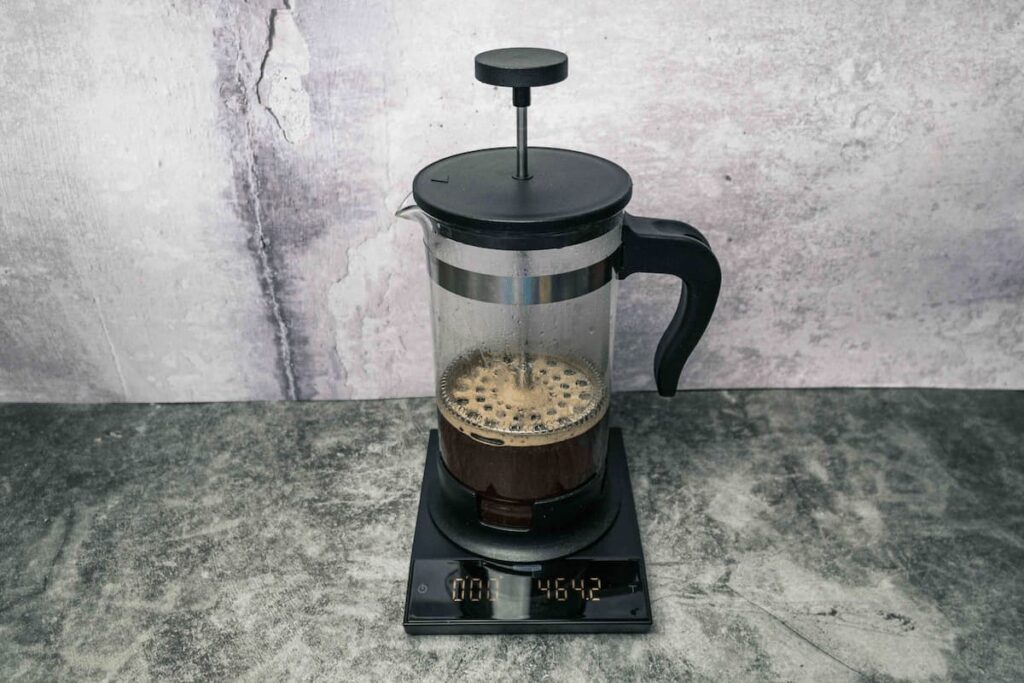 french press on weighing scale